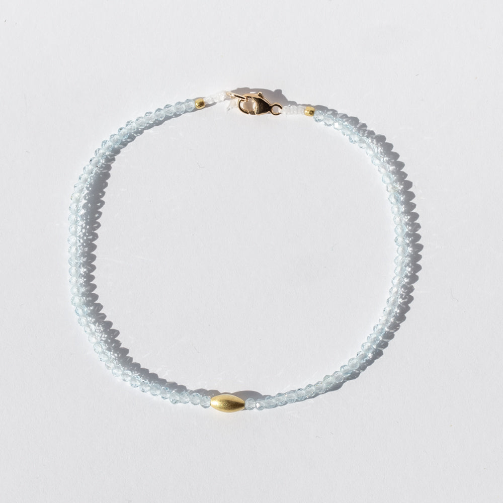 Light Blue Topaz Beaded Bracelet with Oval Gold Bead