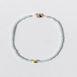 Light Blue Topaz Beaded Bracelet with Oval Gold Bead
