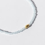 Light Blue Topaz Beaded Bracelet with Oval Gold Bead