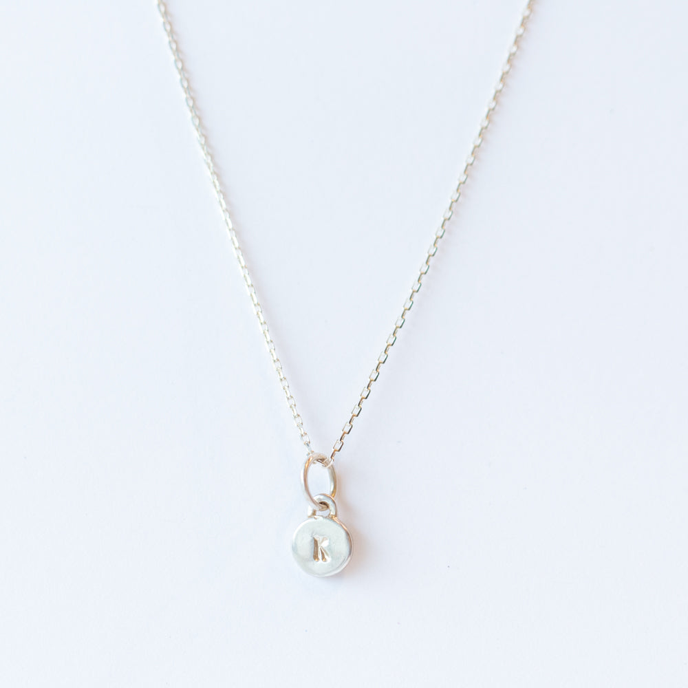 Itty Bitty "K" Disc Charm