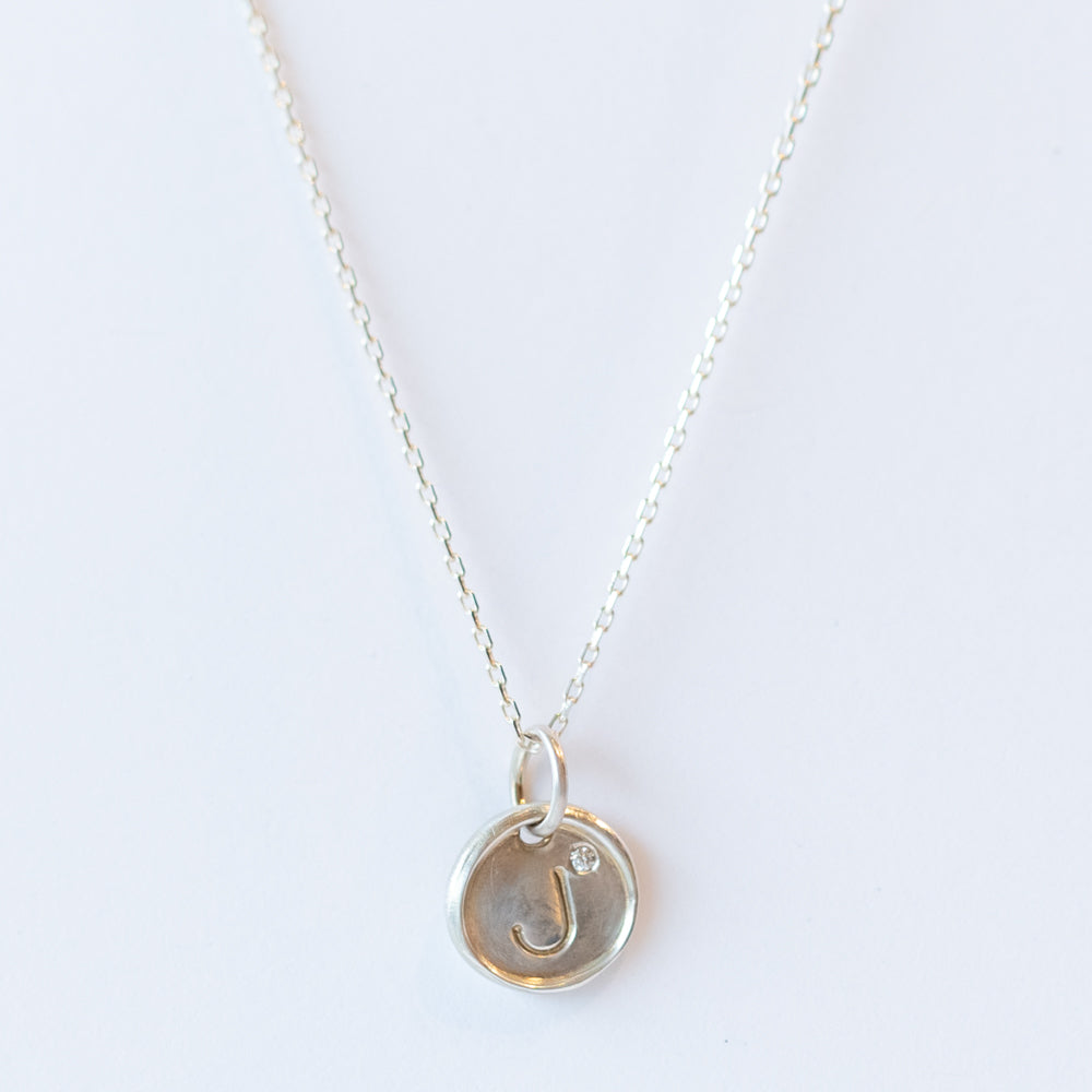 Tiny Disc Letter Charm with Diamond