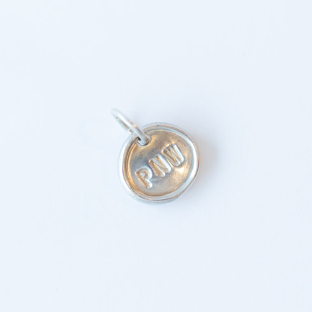 Tiny "PNW" Disc Charm