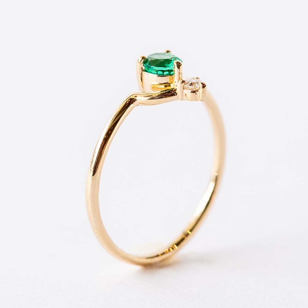 Small Round Nestled Emerald and Diamond Ring
