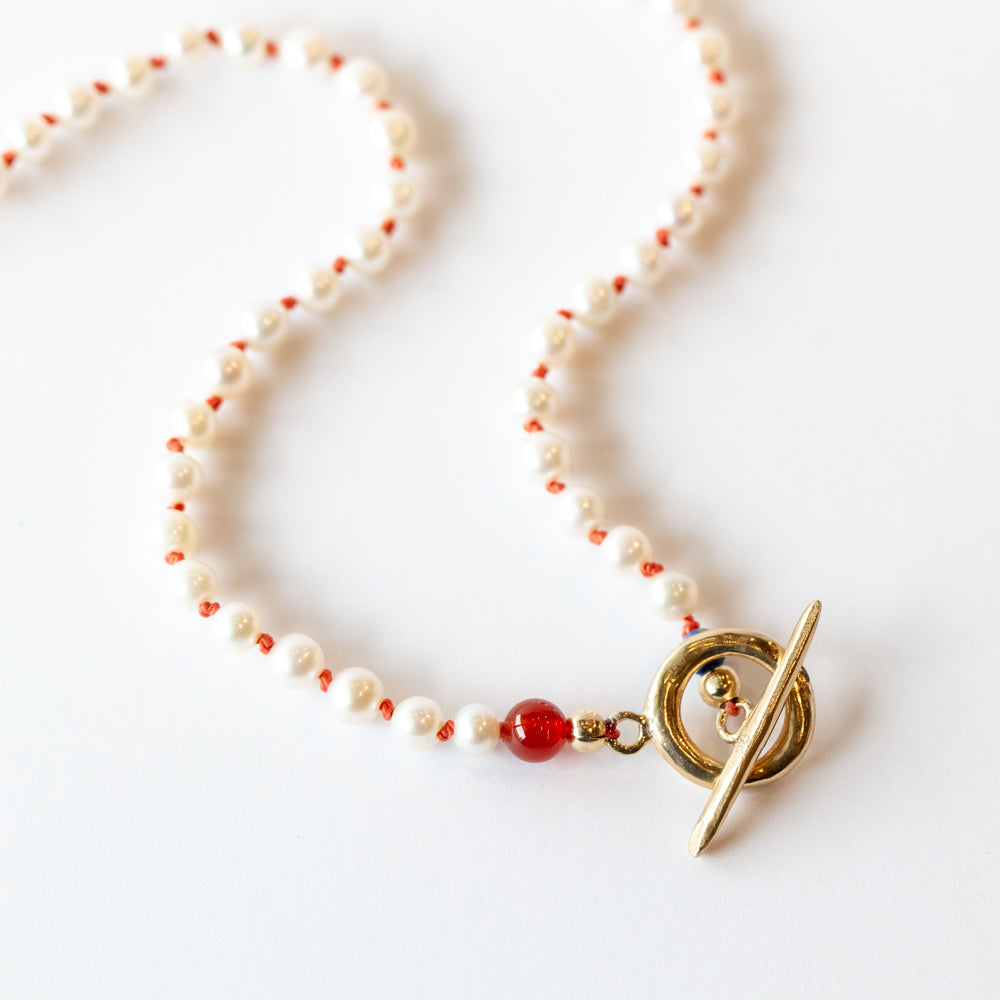 Round Pearl Toggle Necklace on Coral Thread