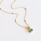 Bezel Set Emerald Cut Emerald Solitaire Necklace