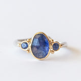 Asymmetrical Oval Sapphire Ring with Accent Sapphires