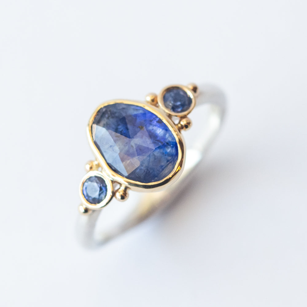 Asymmetrical Oval Sapphire Ring with Accent Sapphires