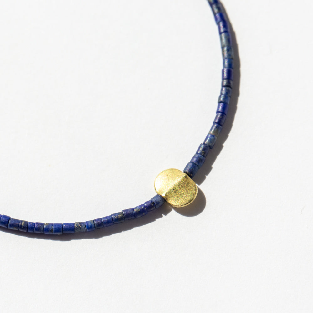 Dark Lapis Tube Beaded Bracelet with Oval Flat Gold Bead