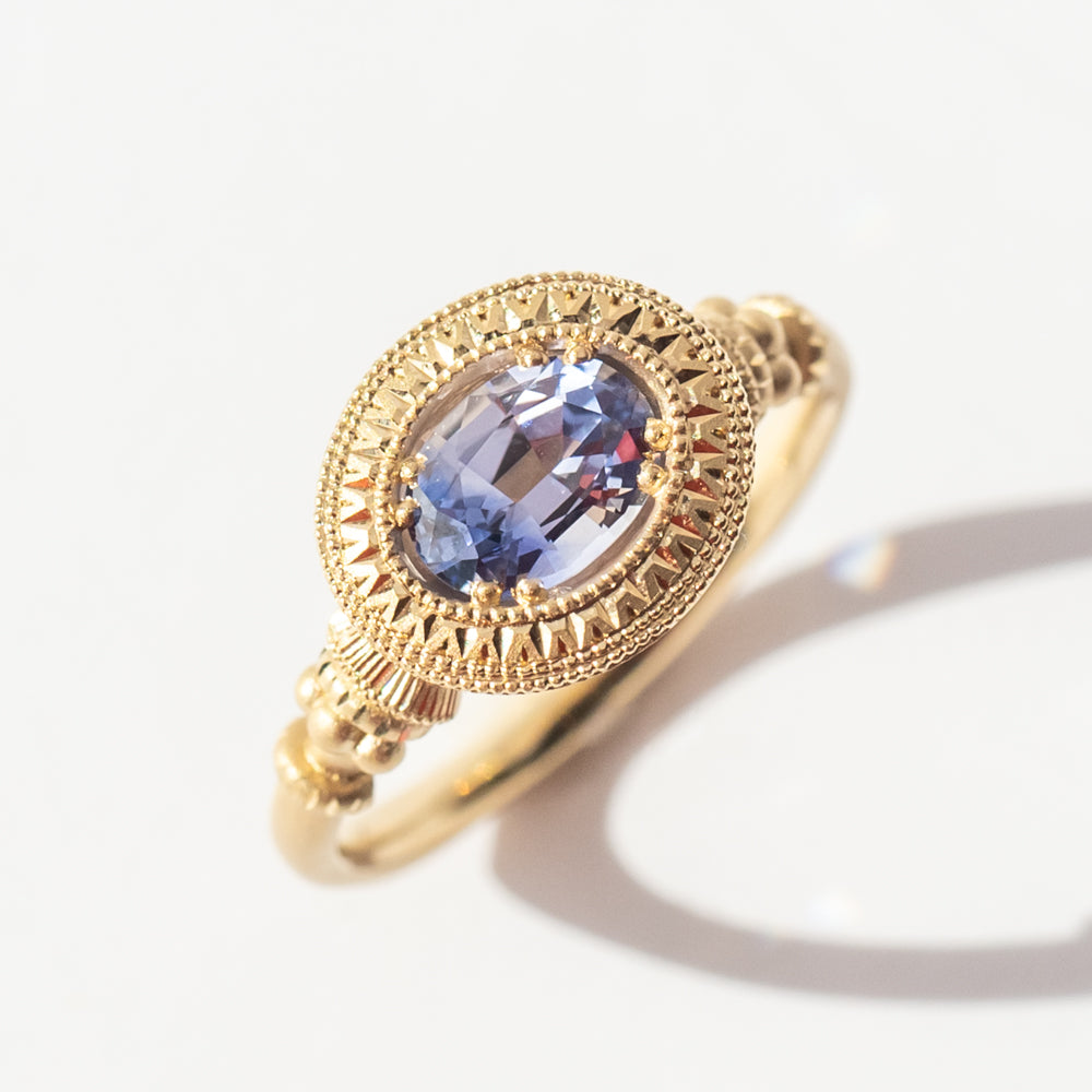 Engraved Bi-Color Oval Sapphire Pedestal Solitaire Ring