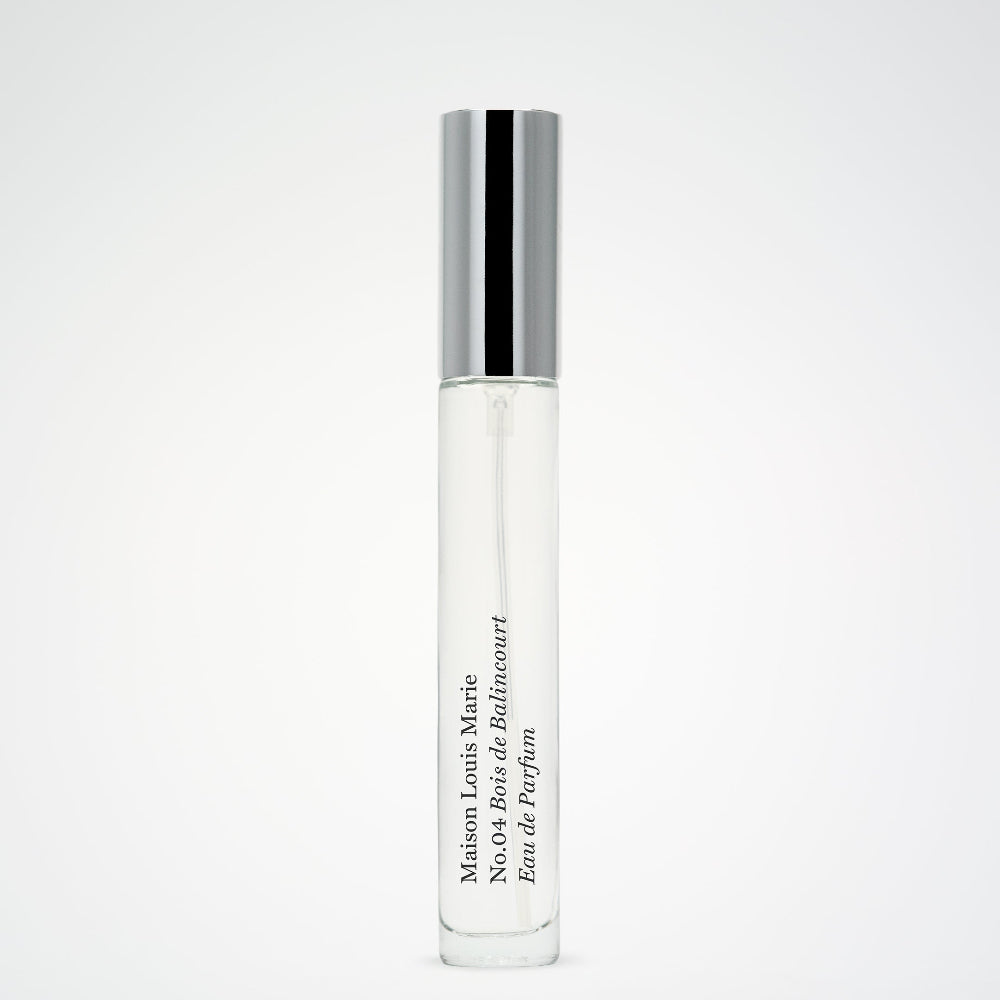 Travel-sized slim perfume bottle with silver cap on a white background