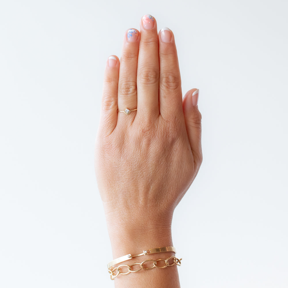 Small Nestled Princess Cut Diamond Ring