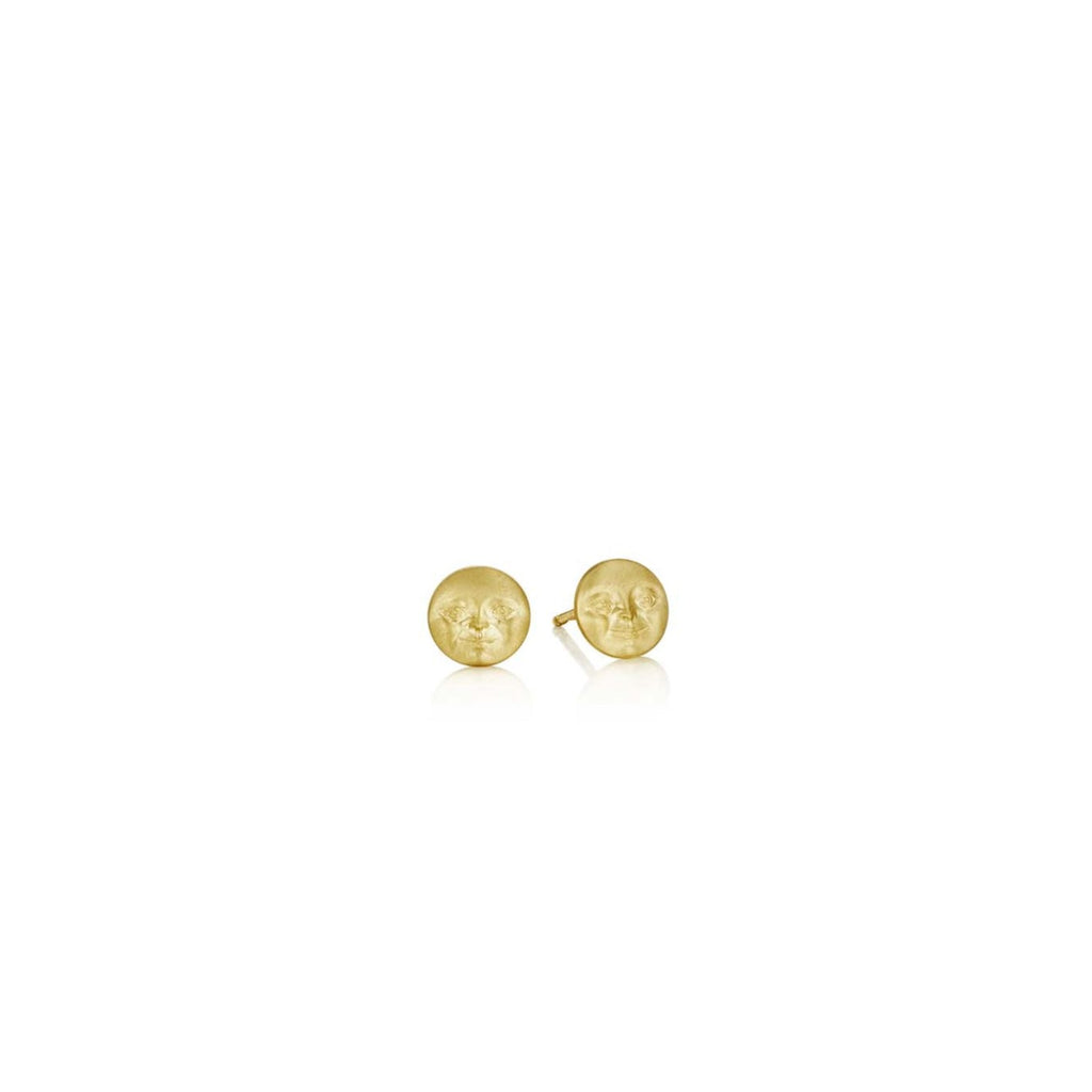 Tiny full moon gold stud earrings with faces, angle view