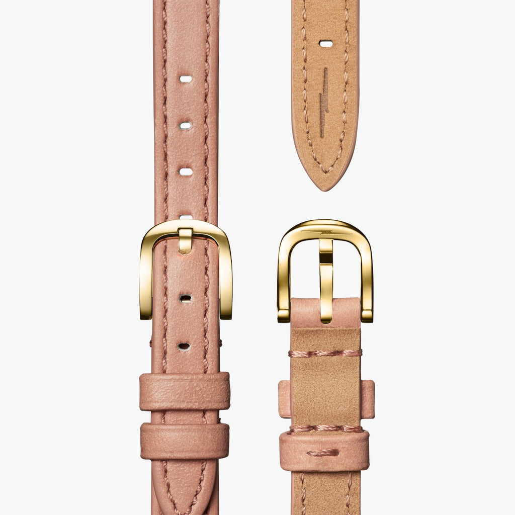 shinola watch with mother of pearl face and gold numbering, round face in stainless steel with blush leather thin strap