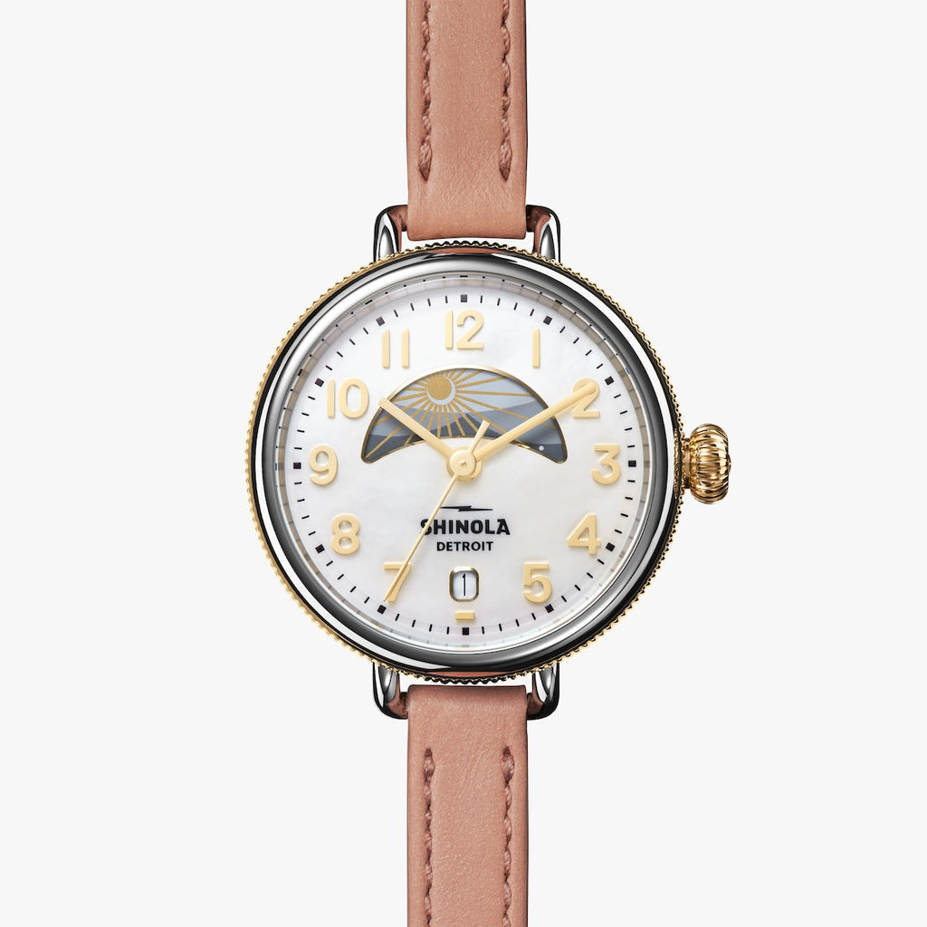 shinola watch with mother of pearl face and gold numbering, round face in stainless steel with blush leather thin strap