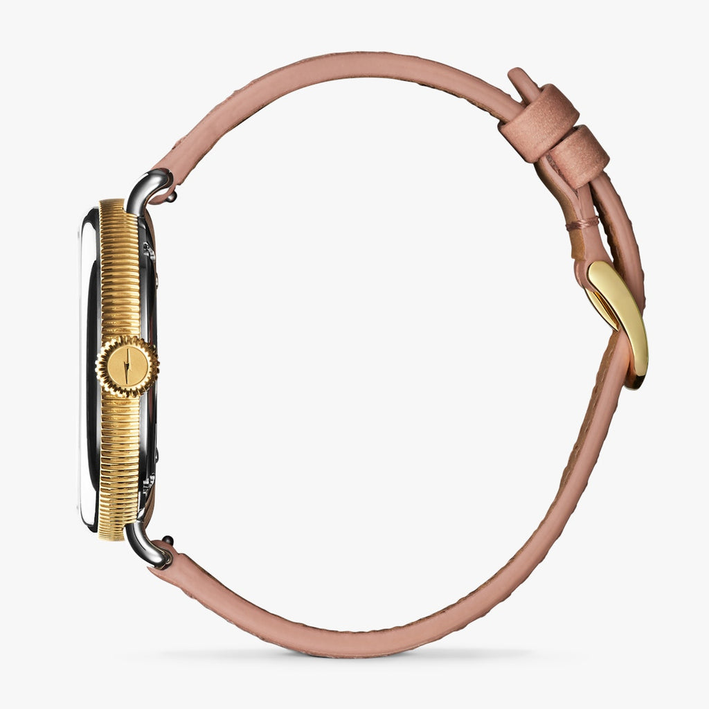 shinola watch with mother of pearl face and gold numbering, round face in stainless steel with blush leather thin strap