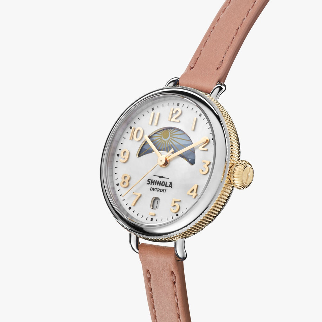shinola watch with mother of pearl face and gold numbering, round face in stainless steel with blush leather thin strap