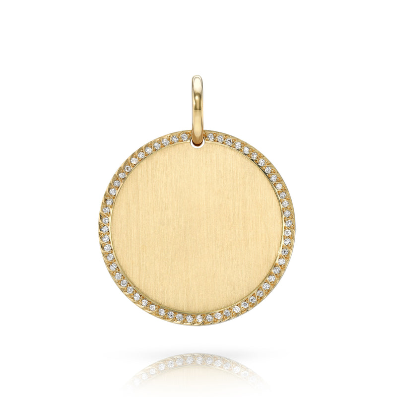 A yellow gold, round disc charm with a ring of diamonds around the outer edge and a brushed matte finish.