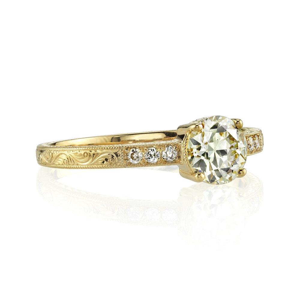 Single Stone gold ring with diamonds, angled front view