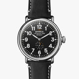 Shinola black face stainless steel watch black leather strap, front view