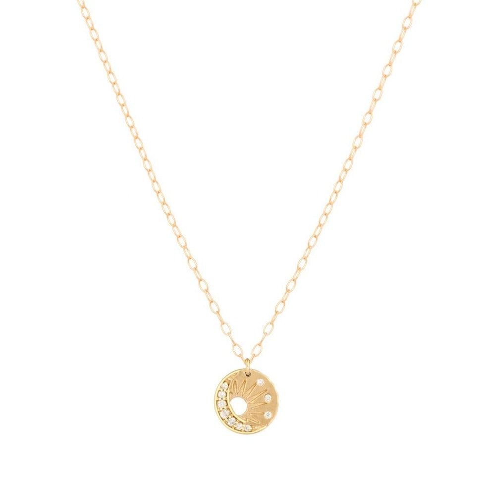 Celine D'aoust gold necklace with sun and moon pendant and diamonds, front view