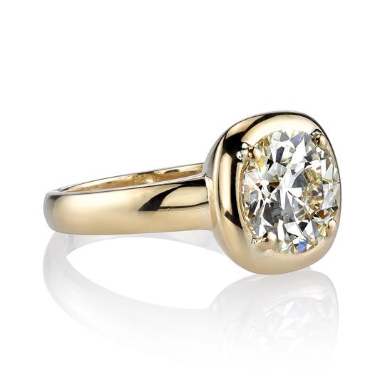 Single Stone gold ring with diamond, angled side view