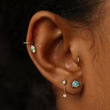 Wwake opal stud earring on model, front view