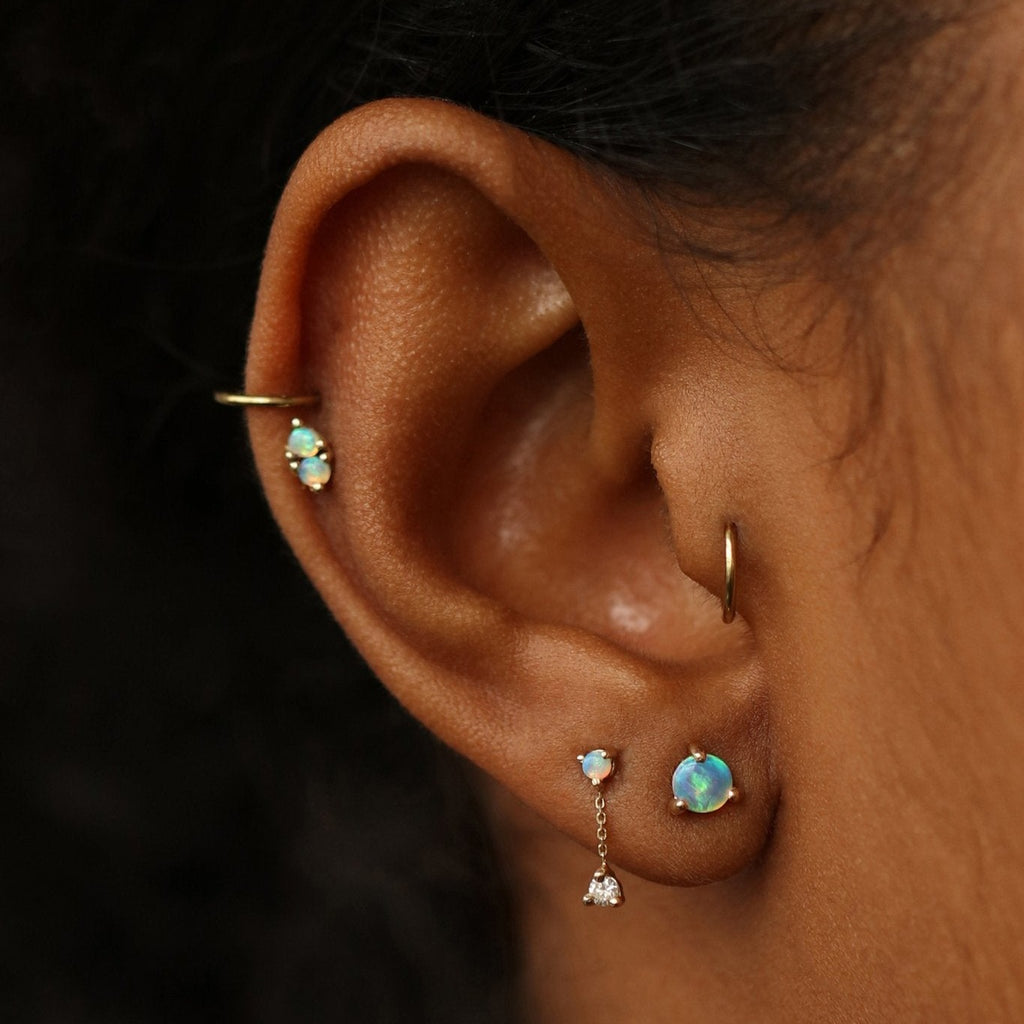 Wwake opal stud earring on model, front view