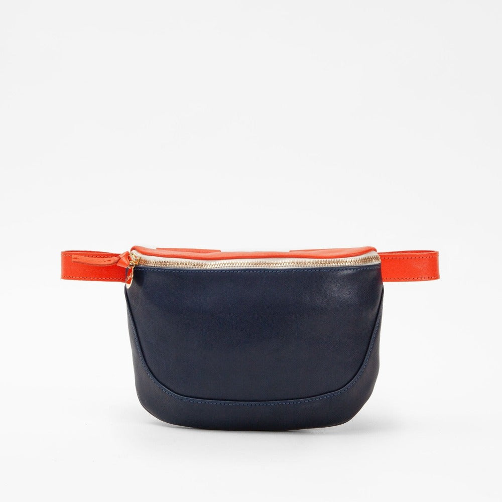 Clare V. navy and orange leather fanny pack, front view
