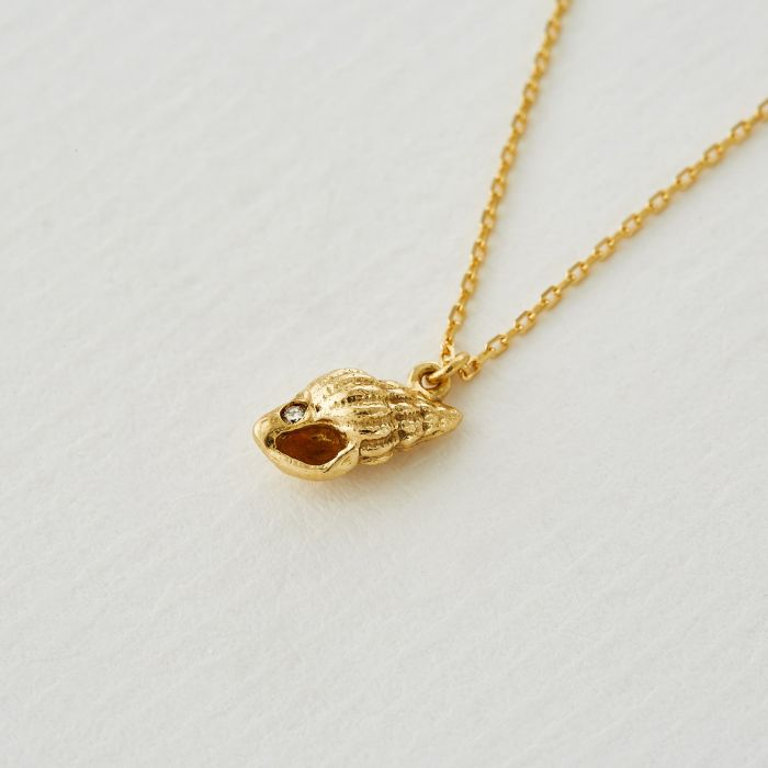 Alex Monroe gold necklace with shell pendant and diamond, front view