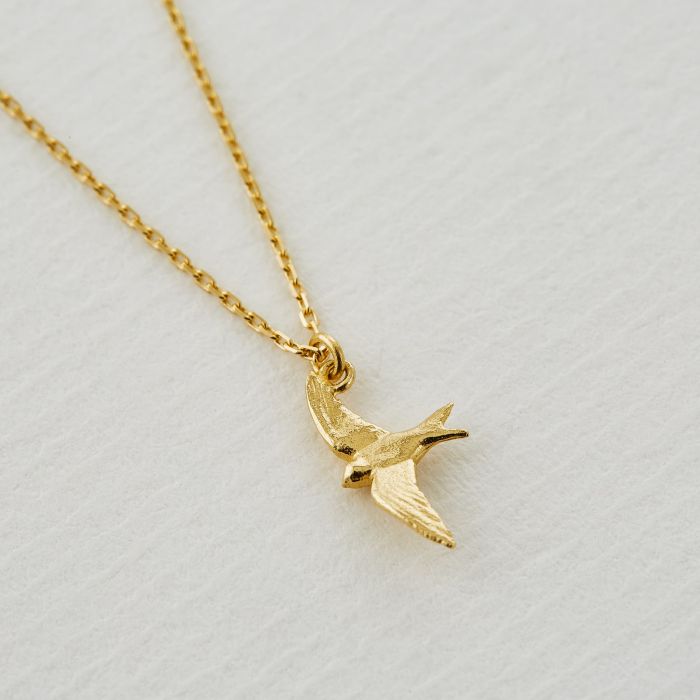 Alex Monroe gold necklace with bird pendant, front view