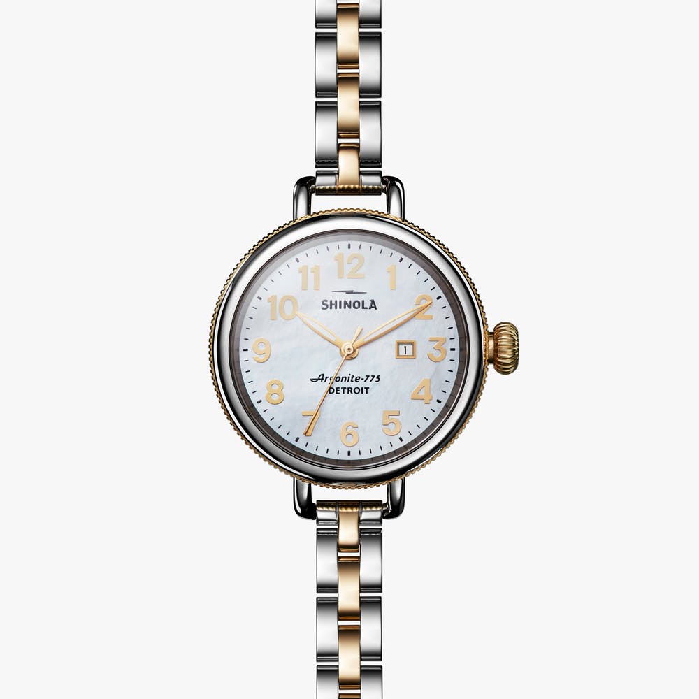 Shinola stainless steel silver and gold watch, front view