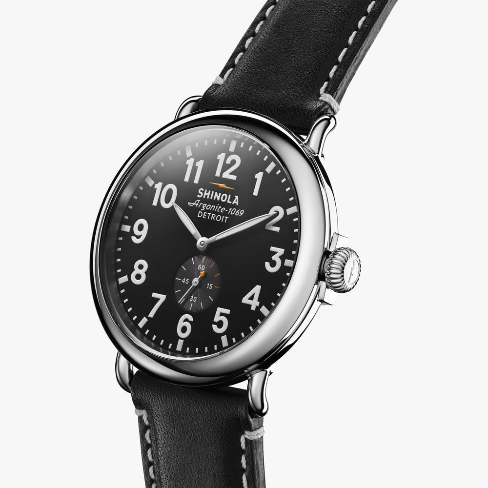 Shinola black face stainless steel watch black leather strap, angled front view