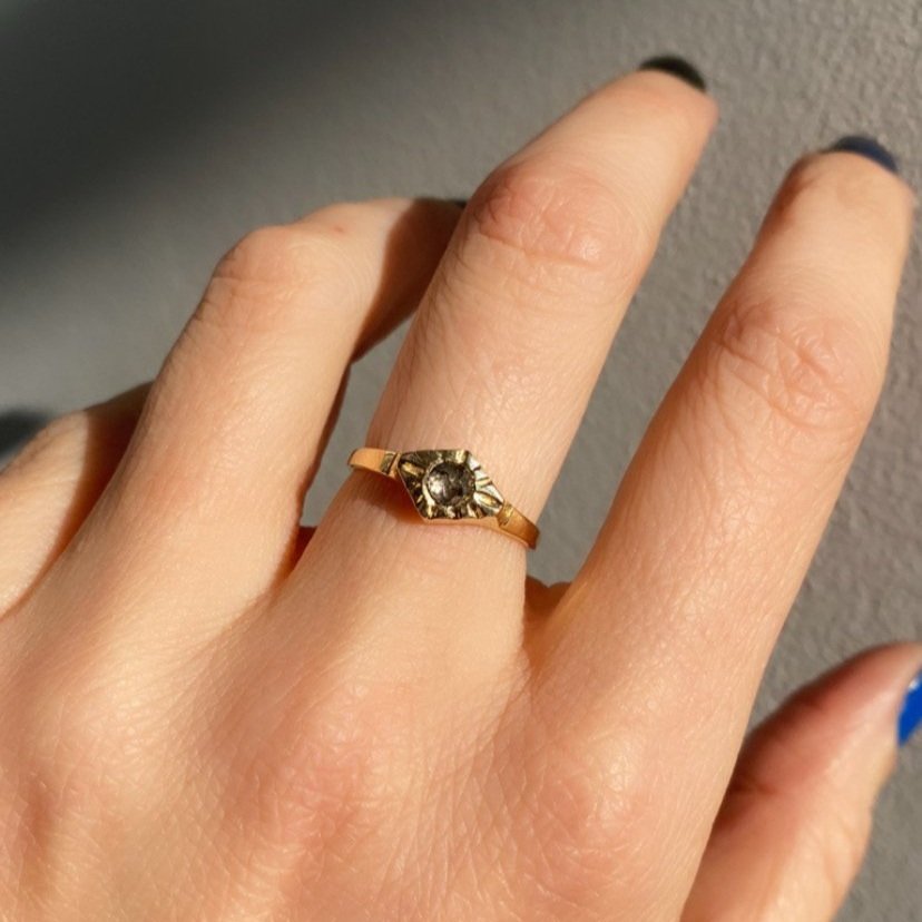 Adeline gold ring with gray diamond on model, front view