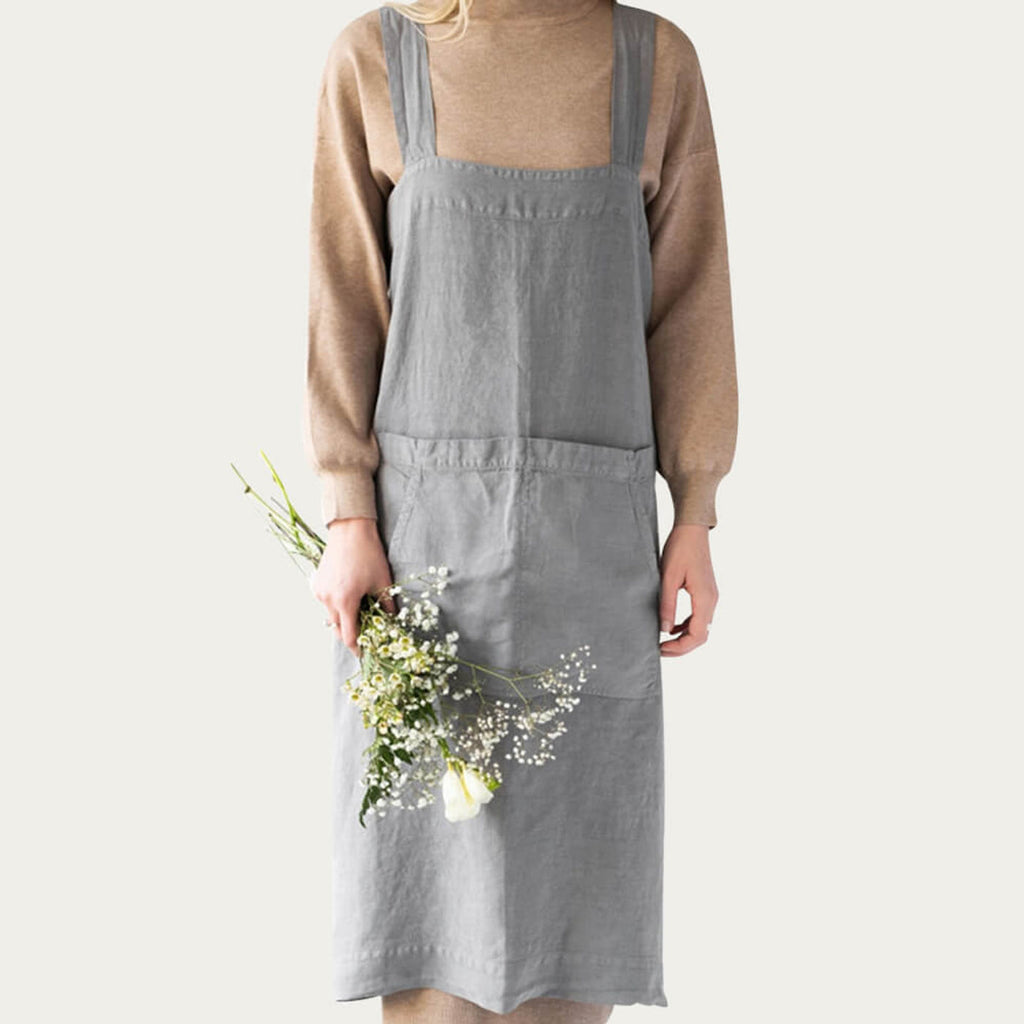 Linen Tales gray apron on model, front view