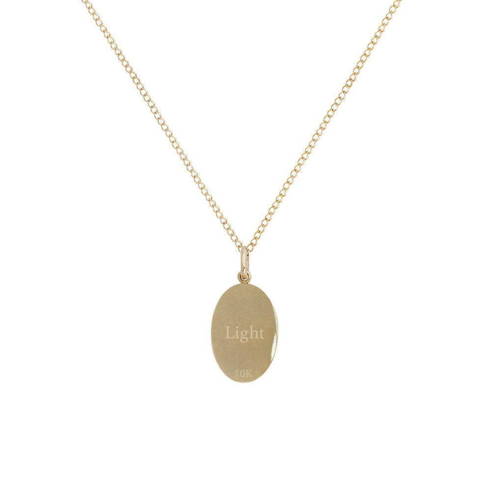 Zahava gold necklace with pendant engraved with light text, back view