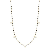 Gigi Clozeau black and gold beaded necklace with 5 diamonds, front view