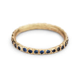 Ruth Tomlinson gold band with blue sapphires, front view