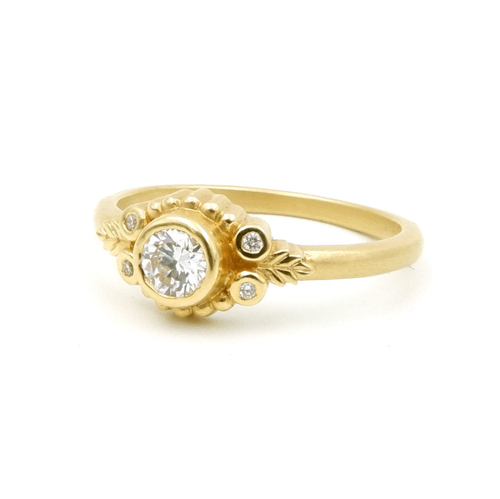 Megan Thorne gold ring with diamonds, angled front view