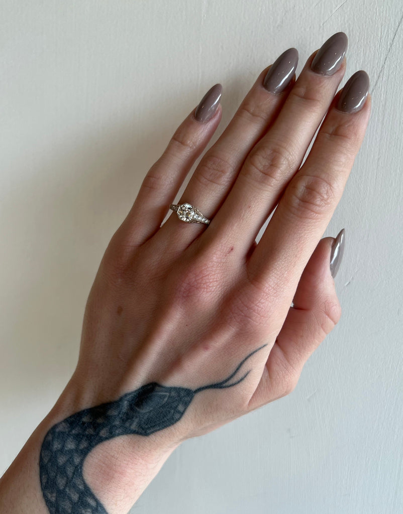 Single Stone champagne gold and diamond ring on model, front view