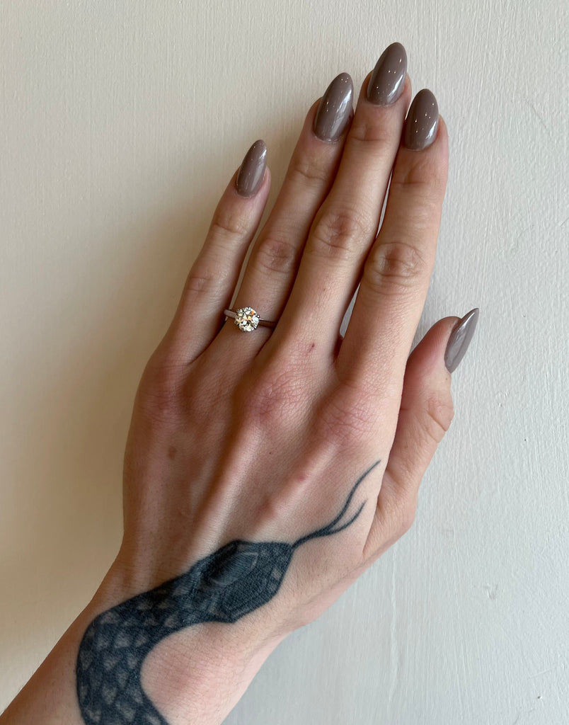 Single Stone platinum ring with diamond on model, top view