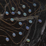 Wwake oval opal pendant gold necklace, top view