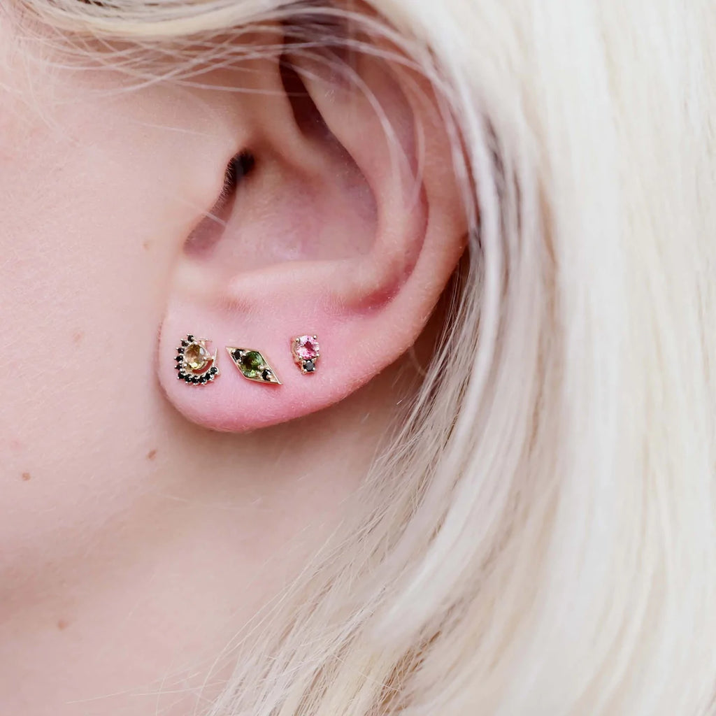 Miarante gold stud earrings with pink tourmaline and black diamonds on model, front view