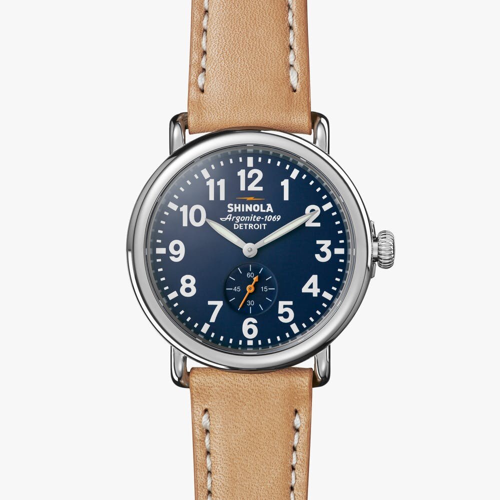 Shinola blue stainless steel watch with tan leather strap, front view
