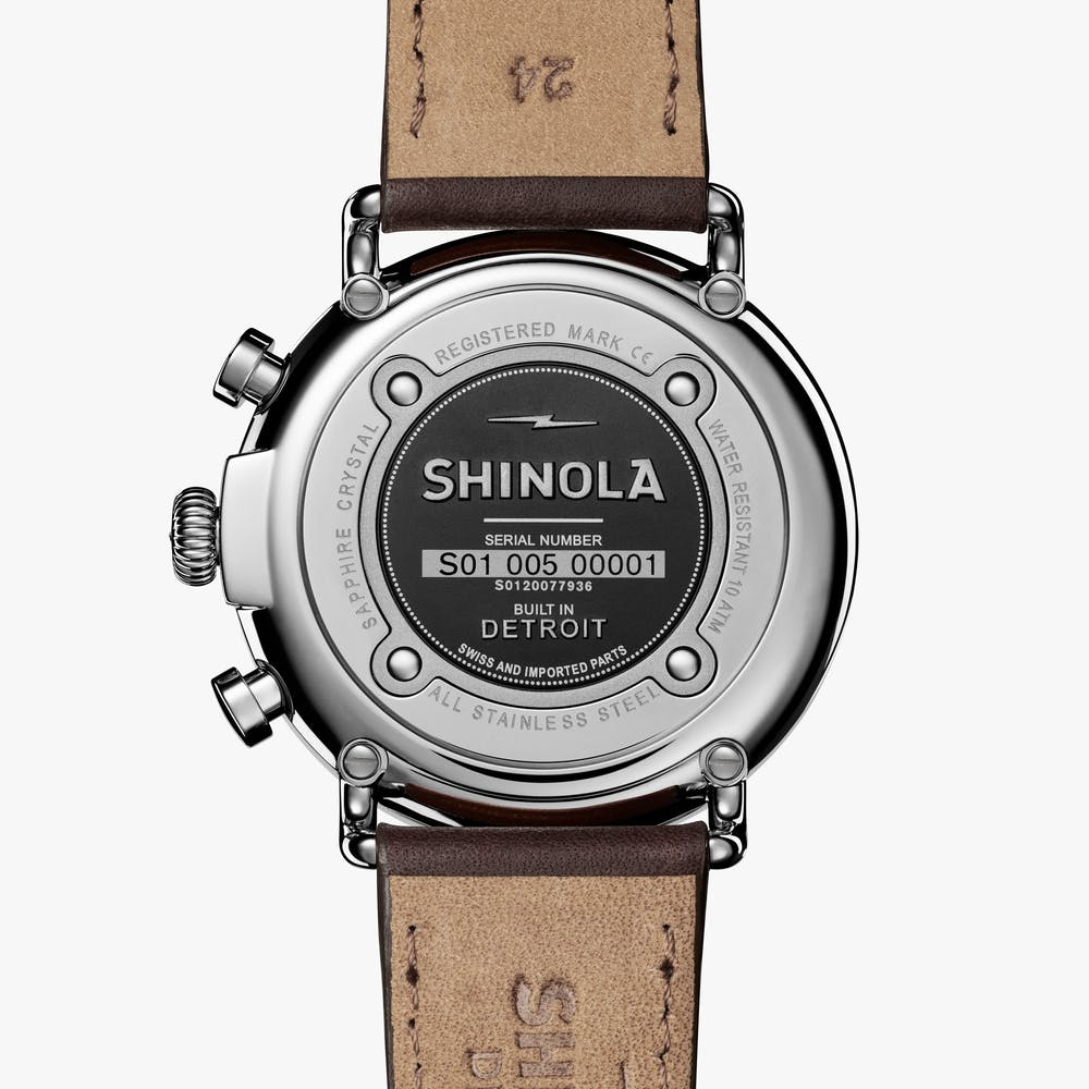 Shinola silver watch stainless steel with brown leather strap, back view
