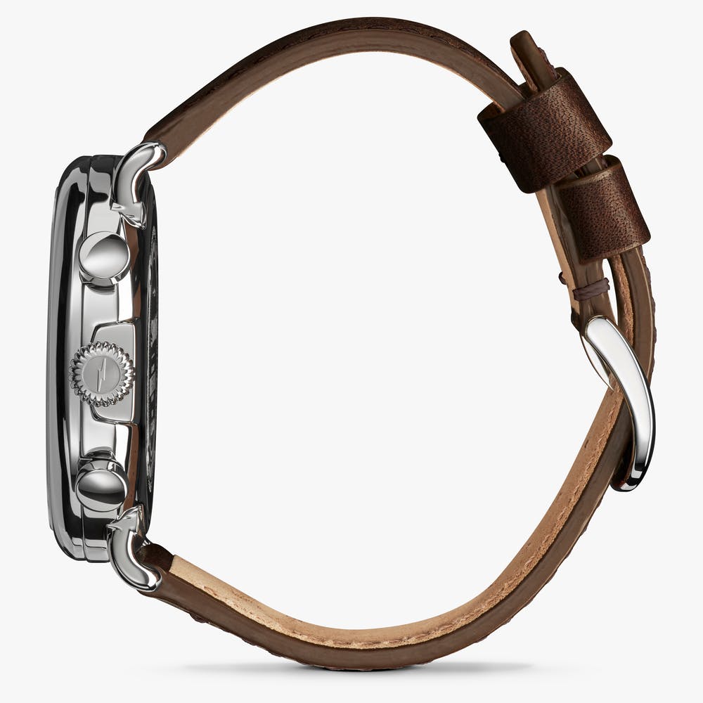 Shinola silver watch stainless steel with brown leather strap, side view