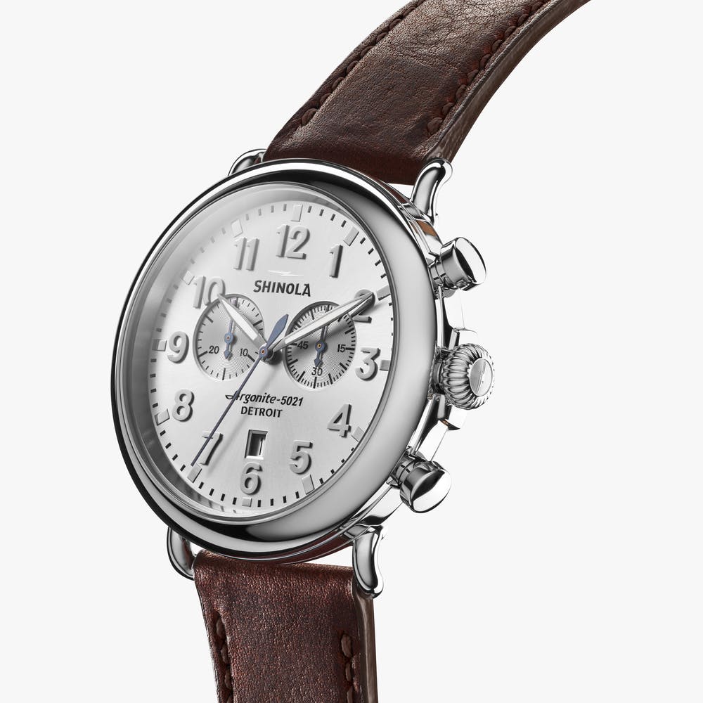 Shinola silver watch stainless steel with brown leather strap, angled front view