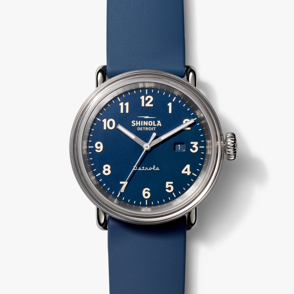 Shinola stainless steel watch with blue face and blue silicone strap. front view