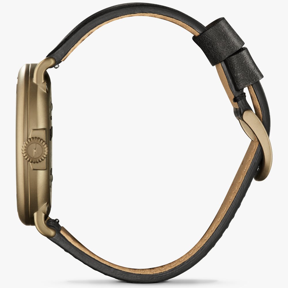 Shinola black watch face gold case with black leather strap, side view