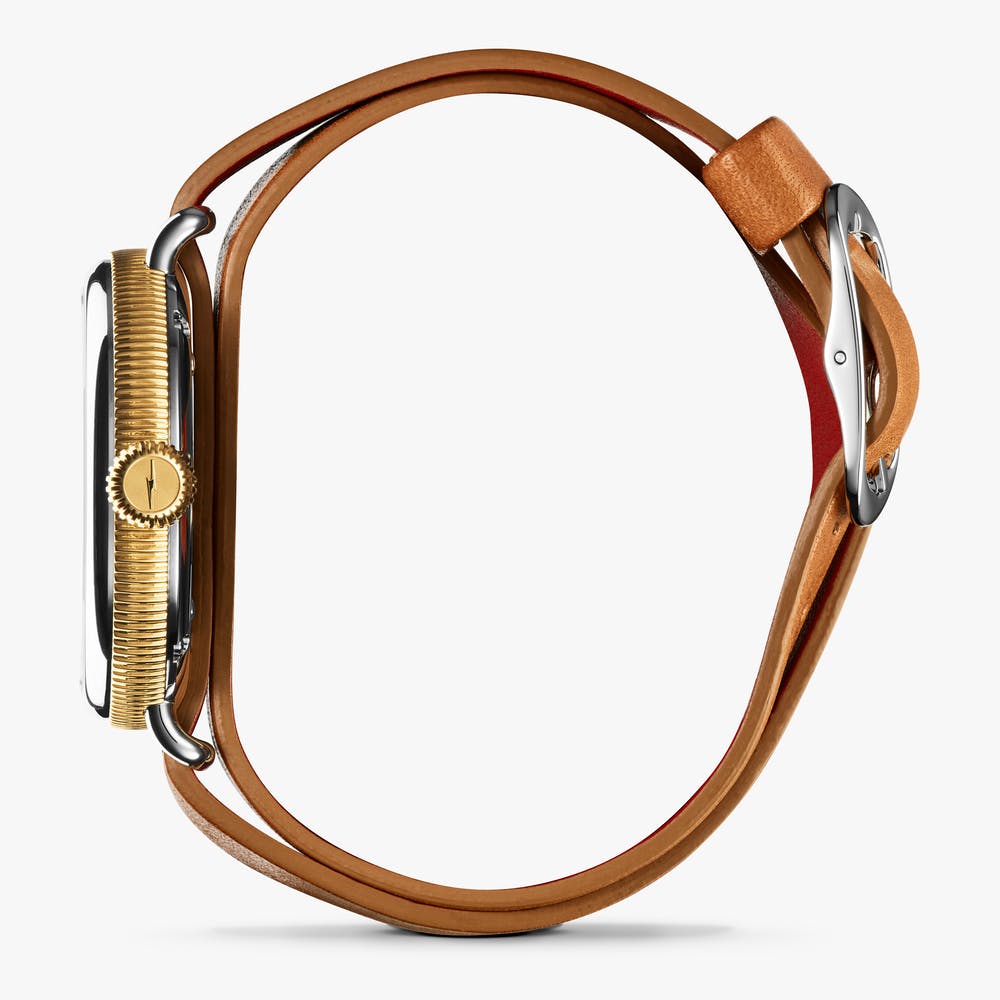 Shinola stainless steel watch with double looped bourbon leather strap, side view