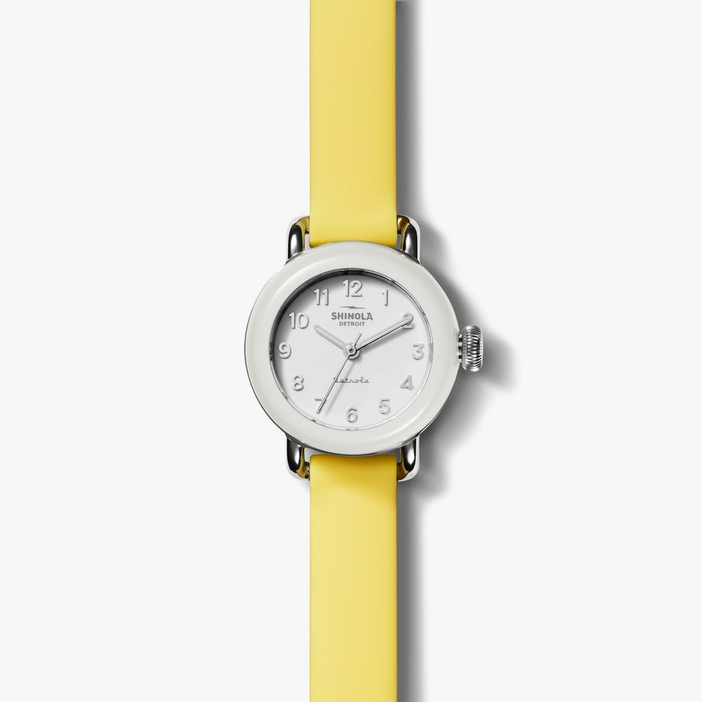 Shinola white watch face with yellow silicone strap, front view